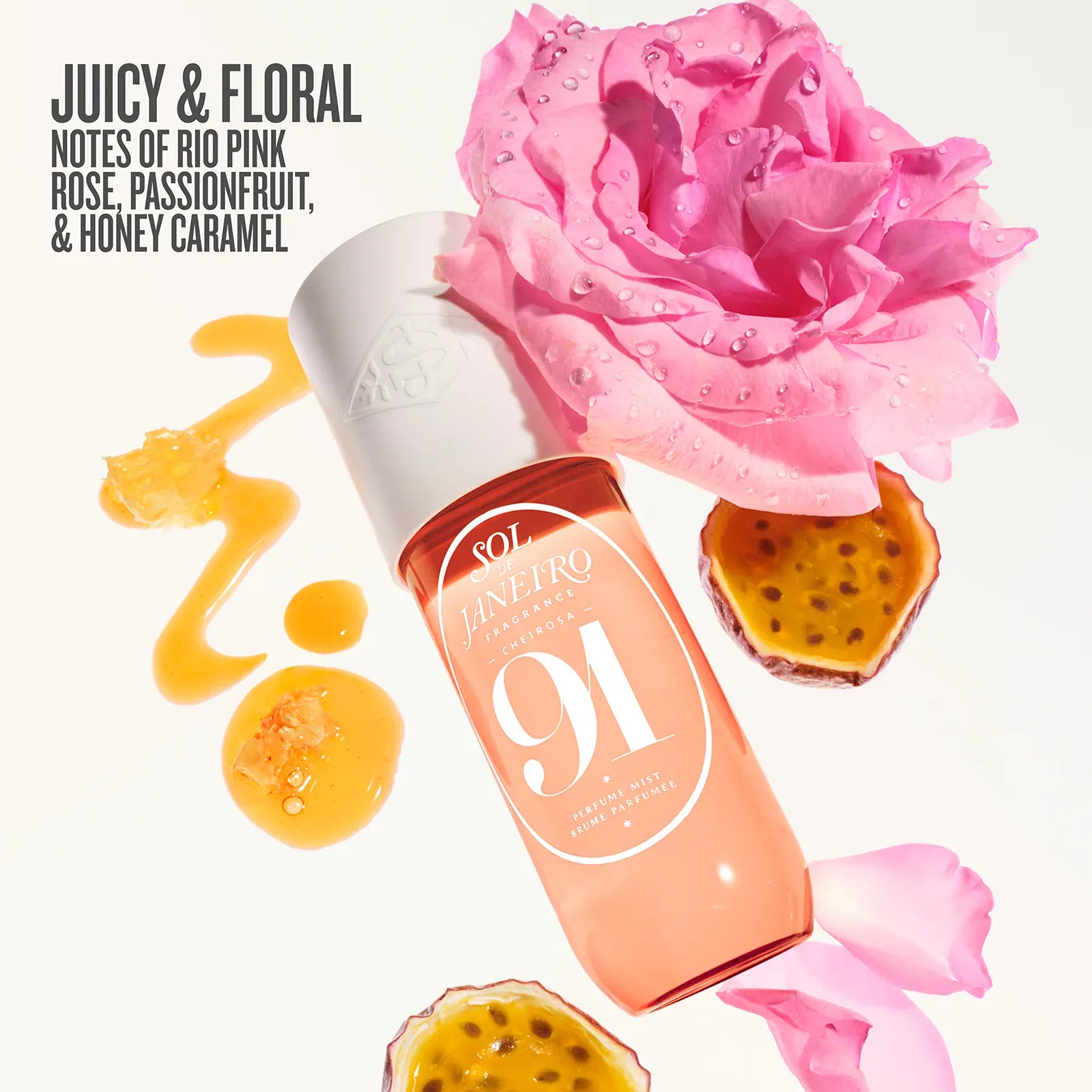 Cosmetic bottle with pink rose and passionfruit slices on a white background